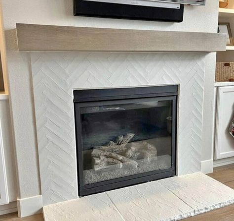 Herringbone Fireplace Surround Tile, White Tile Fireplace With Wood Mantle, Herringbone Tile Around Fireplace, Fireplace Chevron Tile, Marble Fireplace Wood Mantle, Schluter Tile Edge Fireplace, White Herringbone Tile Fireplace, Traditional Fireplace Tile Ideas, Herringbone Backsplash Fireplace