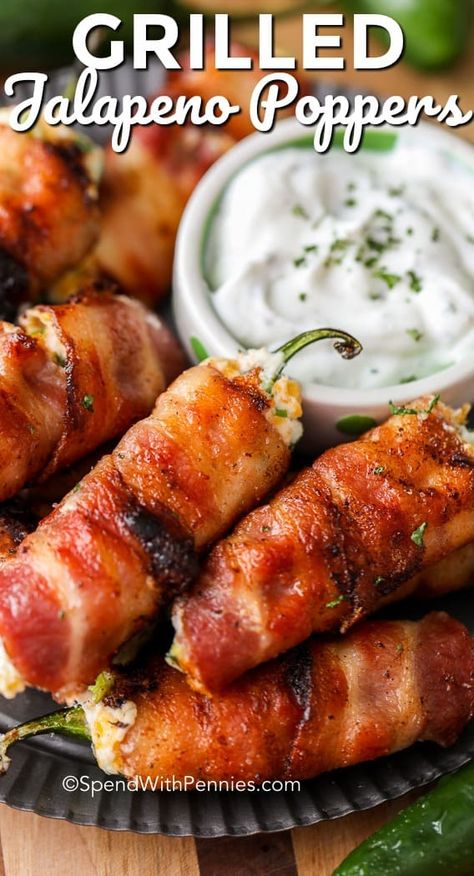 Grilled Jalapeno Poppers are the perfect bacon wrapped jalapeno snack. These creamy poppers are filled with a delicious cheese filling and are the perfect summertime or game day snack! #spendwithpennies #jalapenopopper #appetizerrecipe #gameday #gamedayrecipe #popperrecipe Grilled Jalapeno Poppers, Jalapeno Bacon, Bacon Jalapeno Poppers, Bacon Wrapped Jalapeno Poppers, Jalapeno Popper Recipes, Bacon Wrapped Jalapenos, Jalapeño Poppers, Poppers Recipe, Jalapeno Recipes