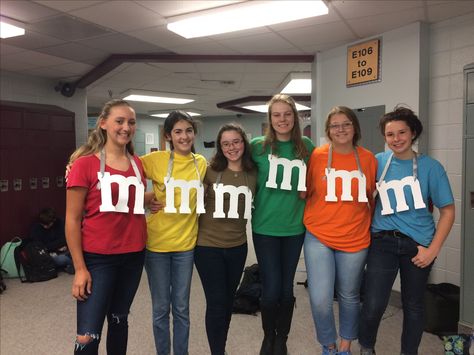 M & M! Great group costume for spirit day or week! Fun and easy! Easy Group Costumes Last Minute, M&m Group Costume, M And M Costume Group, M M Shirts Costume Diy, M&m Halloween Costume Diy, Easy Last Minute Halloween Costumes Diy, Diy M M Costume, M And M Costume, Spirit Day Outfits