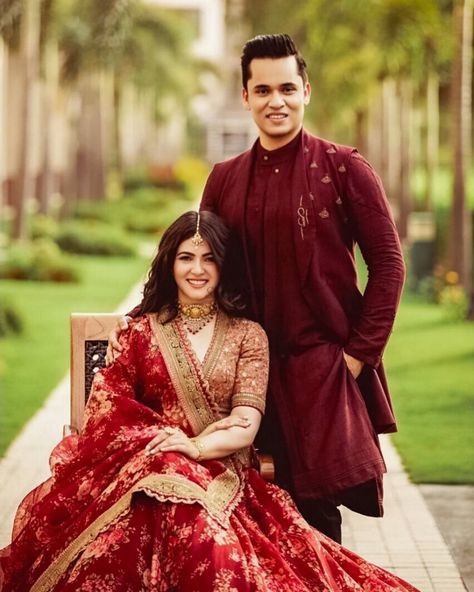 Engagement Attire For Indian Couple, Engagement Outfit Ideas Indian Couple, Red Lehenga For Engagement, Engagement Lehenga Indian Couple, Red Sherwani Indian Groom, Couple Traditional Outfits Indian, Engagement Lehenga For Bride, Engagement Bride Indian, Engagement Lehenga Indian