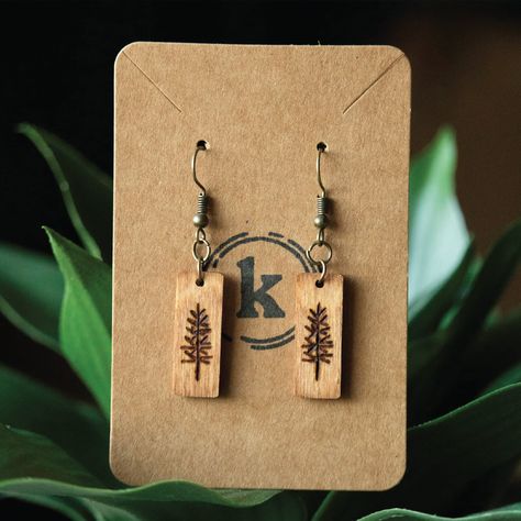 **Please note that each earring is unique and the photo shown is just an example of what you will receive. Due to it being handmade, it is not guaranteed that the earrings will look 100% exactly the same** ✷  1" handmade wood burned earrings made with hypoallergenic hooks with your choice of gold, silver, dark silver, or bronze. (2.5" total length including hook) ✷  Colored/stained earrings are painted with watercolor and finished with a polyurethane clear coat to seal and protect the color.  ✷  Each earring is colored the same on the front and back, but the design is only on the front.  ✷  Earring care: To make your earrings last longer, it is recommended to take them out while you shower, swim, or get into any type of water, as this can ruin them/make the color fade. When not wearing the Wood Burned Earrings, Wood Burned Gifts, Wood Jewelry Diy, Wooden Jewelery, Wood Dangle Earrings, Laser Cut Wood Crafts, Wooden Earrings, Laser Cut Wood, Wood Ornaments