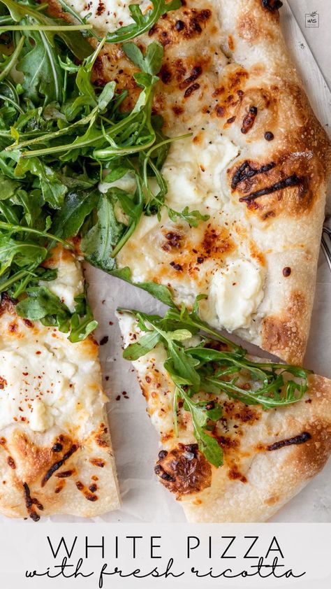 This healthy white pizza recipe is spread with a creamy garlic-scented white sauce and topped with mozzarella, parmesan, and fresh ricotta. Add a pop of freshness with a simple arugula salad or serve it as is for dinner or as an appetizer. White Sauce Pizza Recipe, White Sauce Pizza, Arugula Pizza Recipes, Recipe With Mozzarella, Pizza With Ricotta, Simple Arugula Salad, Pizza With Mozzarella, Garlic Flatbread, Ricotta Sauce