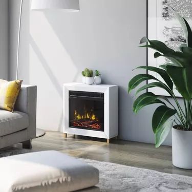 The Complete Guide to Portable Electric Fireplaces | Hunker Mantel Electric Fireplace, Small Electric Fireplace, Portable Electric Fireplace, White Electric Fireplace, Mantel Surround, Freestanding Stove, Electric Fireplace Heater, Fireplace Heater, Wall Mount Electric Fireplace