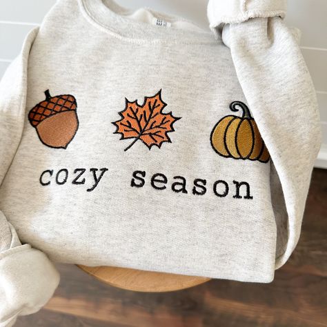 Get ready for fall in our cute 'cozy season' pullover sweatshirt. Pumpkin Hoodie, Embroidered Fall Sweatshirt, Clothes Autumn, Fall Sweaters Aesthetic, Fall Sweatshirt Ideas, Christmas Sweatshirt Ideas, Dance Class Outfit, Usa Embroidery, Fall Crewneck Sweatshirt