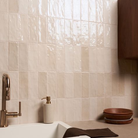 Shop Portmore Sand 3x8 Glazed Ceramic Tile. Ceramic with a handmade look Refresh any space with our Portmore Sand 3x8 Glazed Ceramic Tile, a versatile, classic subway in a go-to neutral shade that suits any design style. Portmore’s appearance—speckled, uneven, and artisanal—lends it a rustic, yet sophisticated vibe. With its subtle, Moroccan influence, this glazed tile will transform your residential or commercial walls with long-lasting, statement-making beauty. Moroccan-inspired, made in Spain Riad Tile Bathroom, Colored Subway Tile Kitchen, Blush Tile Bathroom, Bathroom Tile On Wall, Cream Tile Bathroom, Cream Bathroom Tiles, Beige Shower Tile, Steam Bathroom, Rustic Pub