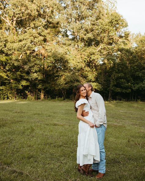 The only better combo than a cotton dress and cowboy boots is Victoria & Bennett at golden hour 🌞🤍🌳 These two are pure happiness 🫶 White Dress With Cowboy Boots Engagement, Cowgirl Boot Engagement Photos, Cowboy Boots With Wedding Dress, Cowboy Boots Wedding Dress, White Dress With Cowboy Boots, White Dress And Cowboy Boots, Wedding Dress And Cowboy Boots, White Dress Cowboy Boots, Wedding Dress With Cowboy Boots