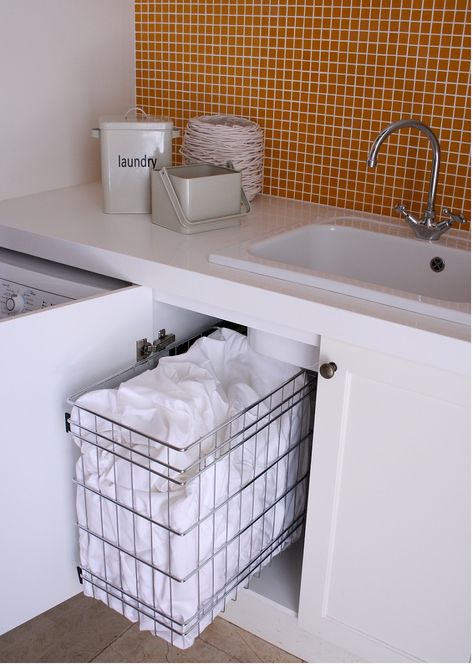 Stainless steel basket for laundry cabinets.  Pull out capability enabling easy access to its contents. Laundry Hamper Under Bathroom Sink, Hamper Under Bathroom Sink, Laundry Basket Under Sink, Laundry Wardrobe, Bathroom Hampers, Laundry Inspiration, Laundry Reno, Industrial Cottage, Bathroom Laundry Hamper