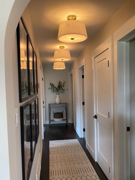 Kitchen Entry Wall Decor, Light Over Gallery Wall, End Of Long Hallway Ideas, Earthy Hallway Ideas, Pendant Lights In Hallway, Apartment Lighting Design, Short Hallway Decorating, Define Space In Open Concept, Large Wall Decor Hallway