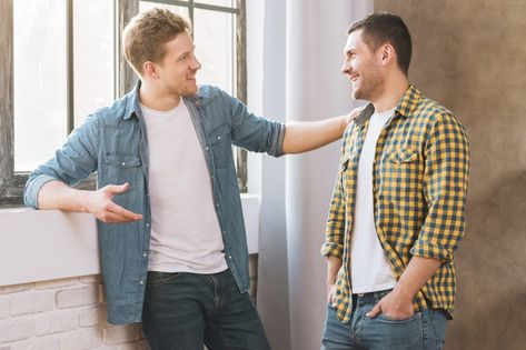 Two smiling young men talking to each other Photo | Free Download Two People Talking Aesthetic, Person Talking Reference, Men Shaking Hands, Personal Financial Management, Men Standing, Hand Shake, Guy Talk, Hands Photos, Shaking Hands