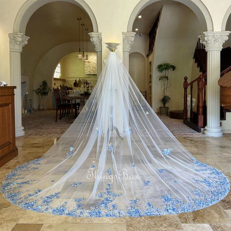 Welcome to my shop - Custom Bridal Veils Crafted with Love I believe every bride deserves to shine with a veil as unique as her love story. With over 4-5 years of experience in creating stunning, handcrafted veils, our mission is to add a touch of elegance and personal flair to your special day. *Picture Color : Ivory tulle. blue lace, gold lace *Picture Length : Cathedral 118" *Custom Length: Elbow 26", Fingertip 36, Waltz 54", Floor 72", Chapel 90", Chapel 98", Cathedral 118"，Royal 137" * If you want to custom your veil, please leave notes for me. Here are some general tips for cleaning a veil made of tulle: Spot Cleaning: For small stains or spots, gently dab the affected area with a mild detergent diluted in water. Use a soft cloth or sponge and avoid rubbing vigorously, as this could Celestial Wedding Veil, Regal Veil, Bridal Veil Ideas, Unique Veils, Unique Wedding Veils, Wedding Veil Cathedral, Veil Pearl, Custom Veil, Blue Veil