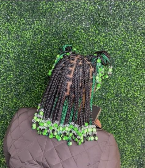 Green Hairstyles Black Women Braids, Short Knotless Braids With Beads Green, 2 Color Box Braids With Beads, Braids With Green Beads, Green And Black Braids With Beads, Green And Black Knotless Braids With Beads, Braided Hairstyles For 10-12, Bead Hairstyles Black Women, Green Braided Hairstyles