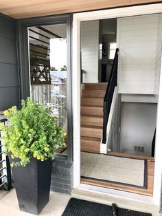 . Split Entry Front Door, Hallway To Garage Decor, Raised Ranch Remodel Entryway, Split Home Entry Way, Front To Back Split Level House Interior, 1980s Split Level Remodel Interiors, Back Split House Remodel, Entryway Ideas Split Level Front Entry, Split Level Decorating Living Room