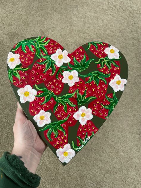 Hand painted strawberries on a heart shaped canvas What To Paint On A Heart Shaped Canvas, Things To Paint On Heart Shaped Canvas, Love Theme Painting, Painting Ideas Heart Canvas, Heart Shaped Painting Ideas, Cute Heart Paintings, Heart Canvas Ideas, Heart Shaped Painting, Heart Shape Painting