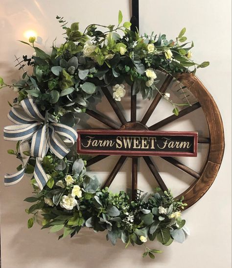 Wagon Wheel Wreath, Decorating Small Spaces Apartments, Wagon Wheel Decor, Mantle Ideas, Apartment Decorating Ideas, Wagon Wheels, Wheel Decor, Summer Door Hanger, Door Wreaths Diy