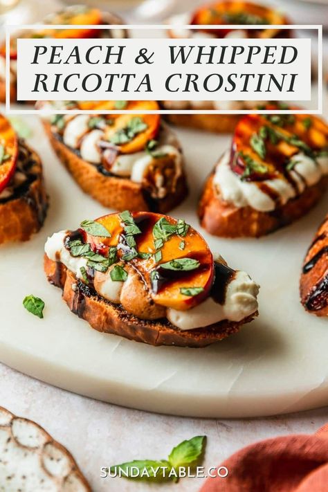 This whipped ricotta crostini is about to be your new favorite appetizer recipe! It has crispy crostini, creamy whipped ricotta cheese, juicy peaches, fresh basil, and balsamic glaze. So good! Of course, you don't have to use peaches on these appetizer bites. You can also try hot honey, pistachios, prosciutto, strawberries, roasted tomatoes, or anything else you like. These crostini are the perfect finger food for a dinner party, holidays, and everything in-between. They're a huge crowd ... Honey Ricotta Crostini, Burrata And Peaches Appetizer, Fancy Crostini Appetizers, Peach And Cheese Appetizer, Prosciutto Crostini Appetizers, Peach Burrata Crostini, Whipped Ricotta Appetizer, Whipped Ricotta Crostini, Italian Snacks Appetizers