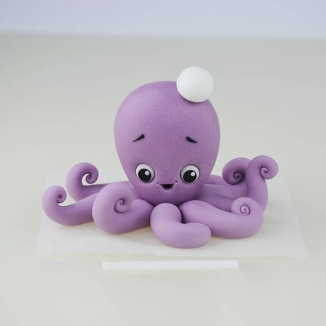 http://cakesdecor.com/entries/3405-simple-cute-octopus-topper Octopus Cake, Cake Topper Tutorial, Fondant Animals, Cute Octopus, Fondant Cake Toppers, Fondant Tutorial, Tanah Liat, Fondant Decorations, Mermaid Cakes