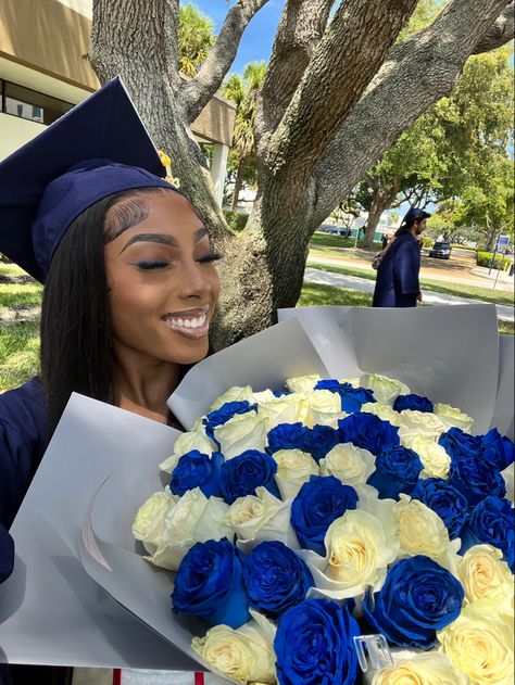 Graduation roses bouquet 2023 grad blue white roses grad cap graduation slefie graduation make up Graduation Flowers Bouquet Blue, Architect Graduation Cap Ideas, Graduation Pictures With Flower Bouquet, Blue Cap Decoration Graduation, Bouquet Of Flowers Graduation, Blue Graduation Gown And Cap, Blue Graduation Cap Designs, Grad Flowers Bouquet, Blue Grad Cap Ideas