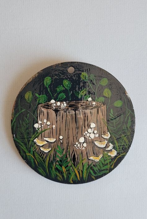 - Original hand painted art on a wooden circle ornament. - Wooden ornament is roughly 3.5 inches in diameter and .25 inches in depth. - Each piece of wood is unique and has natural changes in color, shape, marks, grooves, etc.  - Painted with acrylics and coated with a glossy sealant. -Colors may vary due to difference in monitor/screen lighting.  IMPORTANT NOTE: The wood used is real wood- there may be slight bumps, grooves, variation in the wood grain, and it may not be perfectly flat. If that Painted Wood Rounds, Round Painting Ideas, Wooden Painted Ornaments, Flower Painting On Wood, Hand Painted Wood Ornaments, Log Painting, Forest Gift Ideas, Painted Wood Slices, Painted Wooden Ornaments