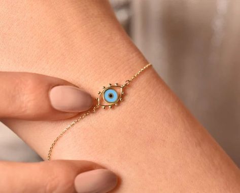 14k Solid Gold Evil Eye Bracelet, Real Gold Protection Bracelet, Dainty Nazar Bracelet, Tiny Gold Bracelet, 14k Minimalist Bracelet Check out our fine jewelry selection for the very best in unique or custom, handmade pieces from our shops. Evil Eye Jewelry Bracelet, Nazar Bracelet, Evil Eye Jewellery, Gold Evil Eye Bracelet, Gold Neck Chain, Pretty Jewelry Necklaces, Gold Rings Fashion, Bracelet Dainty, Fancy Jewellery