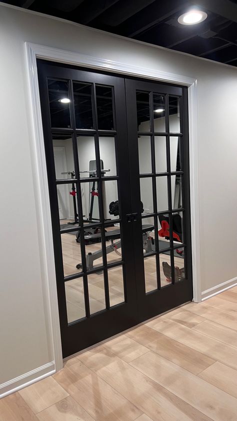 Gym French Doors, Black Door Basement, Basement Gym Doors, Black Framed French Doors, French Doors In Basement, French Doors Basement, Black Doors In Basement, Home Gym Door Ideas, Home Gym Doors