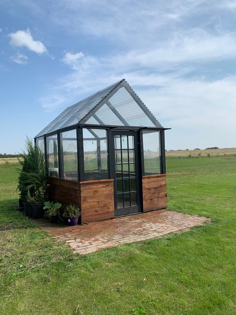 Make your own Post & Beam Greenhouse with twin wall polycarbonate glazing and a concrete foundation! This Timber Frame Style, Western Red Cedar Post and Beam Greenhouse has a footprint that is 10 feet wide and 12 feet long. This modern red cedar and fir structure uses simple joinery and easy to find hardware to construct in your backyard or garden. This plan is an 14 page pdf with fully dimensioned diagrams and construction and assembly instructions, printable on 8.5 x 11 size paper. Dimensions are in inches and millimeters and this plan is designed for actual lumber sizes like you would find at a local sawmill. The plans can be adapted for nominal lumber like you would find at a Big Box Hardware or Building Supply Store. These plans are for download and will not be mailed. See the complet Greenhouse Small Backyard, Greenhouse Hot Tub, Greenhouse Building Plans, Green House Diy Greenhouse Plans, House Inside Greenhouse, 10x20 Greenhouse, A Frame Greenhouse, Stained Glass Greenhouse, Modular Greenhouse