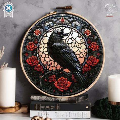 Elevate your cross-stitch collection with our "Gothic Raven and Roses" pattern. This design showcases a majestic raven set against a stunning stained-glass backdrop, adorned with vibrant red roses. The intricate details and rich colors create a perfect blend of elegance and mystery, making it a captivating piece for your home decor or a unique gift for loved ones. Ideal for both novice and experienced cross-stitchers, this pattern brings a touch of gothic charm and artistic beauty to your embroi Red Rose Cross Stitch Pattern, Gothic Embroidery Patterns Free, Wheel Of Time Cross Stitch, Cross Stitch Raven, Gothic Embroidery Design, Gothic Embroidery Patterns, Stained Glass Embroidery, Gothic Cross Stitch Patterns, Witchy Cross Stitch Patterns