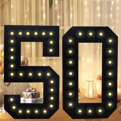 PRICES MAY VARY. 【Large Numbers for Party Decor】3 FT Black pre-cut foam mosaic number frame with warm white LED lights is an eye catching centerpiece for birthday party, anniversary and Christmas. Light up your party and create warm atmosphere! It's also a great way to showcase the age or milestone being celebrated. 【Perfect Party Backdrop-Two Ways to Display】Different from other number, our latest marquee numbers light up numbers can not only be placed on the table or ground steadily with back 50th Birthday Party Table Decorations, Number Mosaic, Light Up Numbers, Marquee Numbers, Foam Frame, Birthday Party Table Decorations, Birthday Party Centerpieces, Marquee Lights, Birthday Party Tables