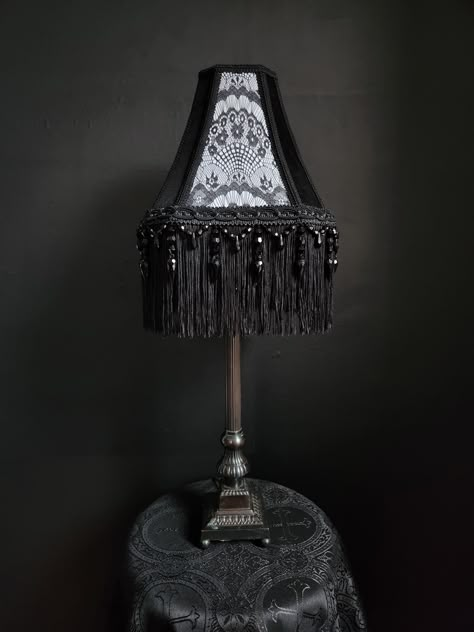 "Very beautiful handmade gothic victorian lampshade. Made with cotton, black lace, and white satin fabric. Along with black braid trim, and black fringe trim. The fringe is 6\" long. The lampshade is an UNO fitter, which has a larger ring and can be placed below the light bulb. *NEW DIMENSIONS Top Width - 4\" x 6\" Bottom Width - 9\" x 12\" Height - 10\" New dimensions are best described as rectangular rather than square.  Perfect for a medium and large lamp base. Inspired through gothic and victorian designs. *All other items in the image are not included" Goth Lampshade, Black Victorian Bedroom, Gothic Interior Design Victorian, Gothic Lamps, Victorian Gothic Bedroom, Victorian Bedroom Aesthetic, Goth Lamp, Gothic Lamp, Gothic Interior Design