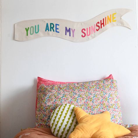 A stunning handmade wall flag with the message 'You Are My Sunshine', sewn on in brightly coloured felt letters. This wall hanging will look stunning hung in your little ones nursery or bedroom boldly wishing them sweet dreams every bedtime and nap time. Handmade to order in my Yorkshire studio the felt letters are sewn on to a natural canvas banner. I recommend attaching the banner to the wall with command strips, not included. Nursery Banner, Flag Wall Hanging, Hanging Flags, Hanging Flag, Canvas Banner, Felt Banner, Wall Flag, Felt Letters, Custom Nursery