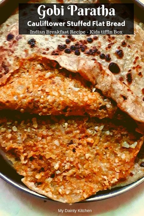 Gobi paratha is a healthy Indian breakfast recipe and a quick kids tiffin box recipe. This is cauliflower stuffed Indian flatbread.  #gobiparatha, #cauliflowerrecipes, #cauliflower, #gobirecipes, #breakfastrecipes, #healthybreakfast, #Indianbreakfastrecipe, #paratha, #Indianflatbread, #kidstiffinboxrecipe, #schoollunchboxrecipe Rice Paratha, Gobi Paratha Recipes, Stuffed Cauliflower, Indian Bread Paratha, Healthy Indian Breakfast, Gobi Paratha, Stuffed Paneer Paratha, Tiffin Lunch Box, Indian Cauliflower Recipes Aloo Gobi