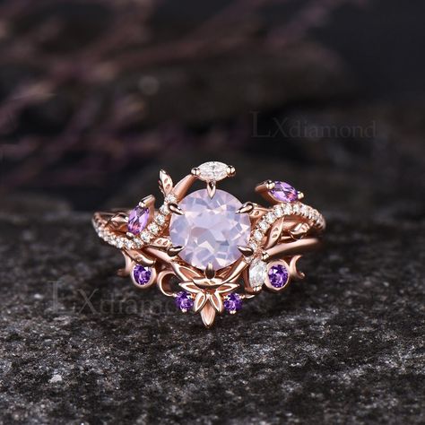 Item description ✦ Handmade, high-quality item! ✦ Material: 925 sterling silver, Solid 10k/14K/18K GOLD (can be made in white/rose/yellow gold) Engagement ring ✦ Center stone: Natural Lavender Amethyst. ✦ Size/Weight: 7mm Round Cut ✦ Side stones: Marquise Cut Natural Amethyst and Marquise Cut/Round Cut Moissanites Wedding band ✦ Gemstones: Round Cut Natural Amethyst Any ring size can be made,if the ring size is not in the option list ,contact me. As it is handmade,it needs 2-4 weeks to finish and then be shipped by usps or DHL. Return policy: We offer 30 days return policy. For any reason, if you are not completely satisfied with your order, you may return it for a refund.  Buyer is responsible for the handcraft fee (15%-30% of the total price) and the return shipping cost. Amethyst Gemstone Jewelry, Rose Gold Gemstone Ring, Rings Engagement Purple, Engagement Rings Fantasy Ring, Amethyst Ring Designs, Amethyst Engagement Ring Gold, Amethyst Engagement Rings, Purple Wedding Rings, Fantasy Rings