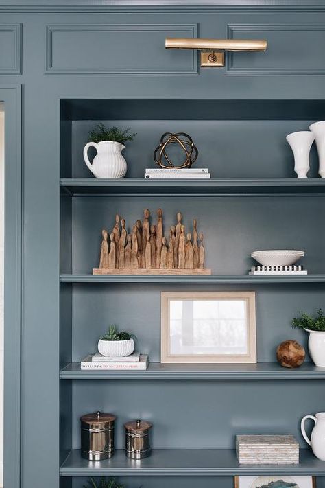 Blue Library, Den Library, Light Grey Kitchen Cabinets, Blue Bookcase, Brass Picture Light, Blue Shelves, Light Grey Kitchens, Light Gray Cabinets, Bookcase Lighting