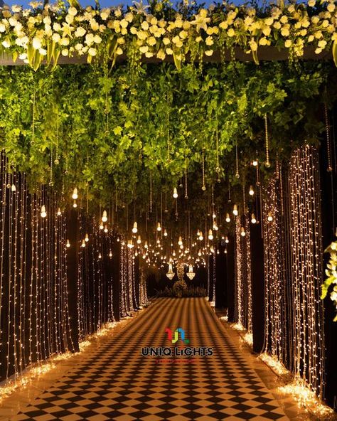 Naushad Khan on Instagram: "Taking our guests on a fairytale ✨ experience as they step into a pathway overflowing with hundreds of sparkly fairy-lights ✨✨✨✨✨ : : Light designing by: @uniq_lights : : Visit us: www.uniqlights.com : Facebook : Uniq lights You tube : Uniq lights Email@: info@uniqlights.com : : : : #wedding #bride #love #weddingphotography #uniqlights #weddingday #weddinginspiration #photography #fashion #weddingplanner #makeup #bridetobe #bridal #prewedding #weddingphotographer #w Light Decoration For Wedding, Lights Entrance Wedding, Fairy Lights Entrance Decor Wedding, Photobooth Ideas For Wedding Receptions, Lighted Pathway Wedding, Bride Haldi Entry Ideas, Outside Indian Wedding, Wedding Tunnel Entrance Fairy Lights, Wedding Lights Decorations