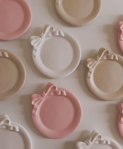 Cutesy bow trinkets 🎀 Ribbon Ceramic, Bow Ceramic, Clay Trinkets, Vanity Inspiration, Pink Dishes, Clay Inspo, Concrete Tray, Beginner Pottery, Acrylic Shelf