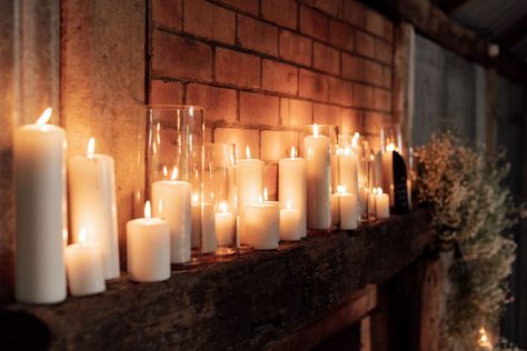 Masses of white pillar candles in a variety of sizes make a stunning fireplace mantle display for your wedding or event. Ideal as a romantic photo background for your wedding photos. Pillar Candles Mantle, Candle Mantle, Mantle Candles, Mantle Display, Ivory Pillar Candles, Romantic Photo, Southern Lights, White Pillar Candles, Romantic Photos