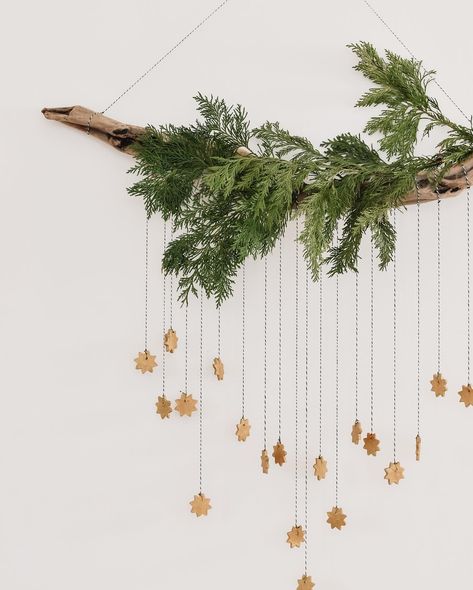 DIY whimsical star hanging ✨ it’s Day 3 in our week of easy Christmas DIY’s. Made with a foraged branch and cedar, twine, and baking soda clay. I’ve used it to add a bit of holiday magic to our playroom, but I think this would suit any living space.... We all need a little extra holiday magic this year right?! Want to give this DIY a try? I’m walking you through the tutorial today in stories, so hit the save button here then hop on over to stories to see how it comes toge Christmas Decorations On Wall, Christmas Hanging Branch, Hanging Branch Christmas Decorations, Diy Christmas Hanging Decor, Xmas Room Decor Diy, Hanging Xmas Decorations, How To Display Ornaments Without A Tree, Christmas Branch Decoration, Hanging Branch Decor