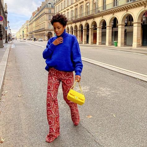 What French Girls Are Buying (and Ditching) for Spring | Who What Wear UK Short Curly Hair Ideas, Blue Bag Outfit, Bright Blue Sweater, Maximalist Outfits, Curly Hair Ideas, Pastel Jacket, Bright Pants, Bright Sweater, Short Curly Hairstyles