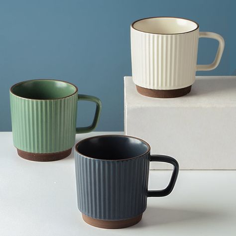 Bring your coffee, tea, or hot chocolate to the next level with these chic cups.Featuring a striped pattern and a simple design, these chic cups are perfect additions to your kitchen decor.The material is ceramic in nature. Caliber: 8CM Handle length: 3CM.Height: 8.5CMCapacity: 250ML Simplistic Style, Home Themes, Retro Beauty, Pottery Mugs, Nordic Style, Ceramic Mugs, Ornament Decor, Hot Chocolate, Simple Designs