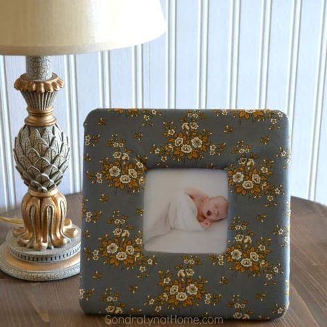 Want to add a soft touch to a nursery, or maybe a bedroom? This DIY fabric photo frame is perfect! It would also make a great handmade gift for Christmas! Making Mesh Wreaths, Sister Crafts, Metal Wreath Frame, Handmade Gift Ideas, Frame Fabric, Rag Wreath, Fabric Ideas, Fabric Pictures, Photo Candles