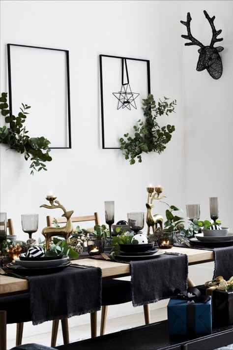 Don’t be afraid of dark colours when decorating your Christmas table. Try using black table mats or runners laid across the width of the table rather than a traditional tablecloth to keep it minimal. Contrast the darker shades with some gold highlights using candle holders or in the centrepiece for an elegant finish #homedecor #interiordesign #Christmasdecor Image: Debenhams Black Christmas Table, Black Christmas Decorations, Deco Table Noel, Christmas Table Decor, Christmas Interiors, White Christmas Decor, Christmas Black, Christmas Inspo, Christmas Table Settings