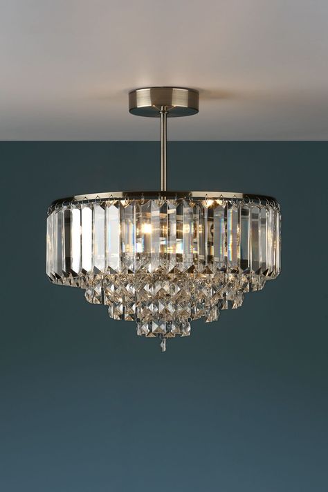 The glamorous Laura Ashley 3 light Vienna ceiling light features bevelled glass 'coffin crystal' rods with a glittering fountain of square-cut faceted glass droplets that fall to a central point, all suspended from a circular frame in a warm antique brass finish. Semi flush fittings are popular as they sit closer to the ceiling than a pendant so are suitable for lower ceilings and smaller rooms, plus they are more decorative and have a neater finish - there are no cables on show as the stem atta Laura Ashley Lighting, Flush Chandelier, Decorative Ceiling Lights, Antique Brass Frame, Circular Frame, Bedroom Light Fixtures, Ceiling Shades, Semi Flush Ceiling Lights, Hallway Lighting