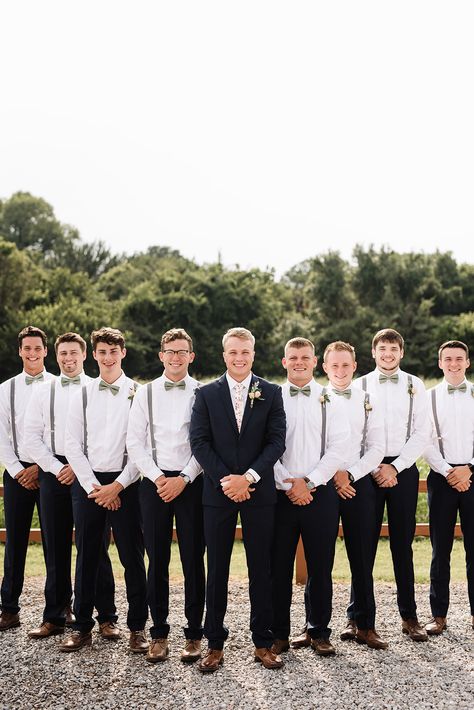 | bohemian groomsmen style | boho groomsmen style | groomsmen in suspenders | 2018 groomsmen style ideas | groomsmen photo ideas | bohemian groom style | boho groom style | groom in a floral tie | groomsmen in bow ties | photo taken at THE SPRINGS Event Venue. follow this pin to our website for more information, or to book your free tour! SPRINGS location:  Edmond, OK photographer:  Kelcy Leigh Photography #groomsmen #groom #weddingstyle #bohemianwedding #bohowedding #fallwedding #autumnweddings Groomsmen In Suspenders And Bow Ties, Groomens Attire Suspenders, Groomsmen Without Suit Jacket, Suspender And Tie Groomsmen, Groom In Suit Groomsmen In Suspenders, Groomsmen Bow Tie And Suspenders, Groomsmen No Jacket Suspenders, Suspenders Groomsmen Attire, Black Pants With Suspenders Groomsmen