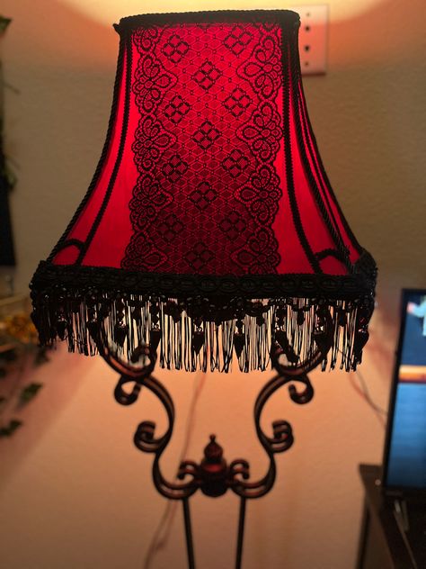 So it was my first attempt at doing up an old boring lampshade and I’m actually pretty pleased with how it turned out! Started with a white lampshade from Goodwill, painted it red, hot glued the lace, gimp rope, and fringe along the bottom. Then I went ahead and painted the whole base black. I painted the inside of the lampshade so it’d give off a nice warm red light in the living room. Bought everything but the beads at Hobby Lobby for cheap. Had so much fun with my daughter making this!🖤 Gothic Lamp, Beaded Fringe Trim, Victorian Table Lamps, White Lampshade, Red Gothic, Victorian Table, Diy Lamp Shade, White Lamp Shade, Warm Red