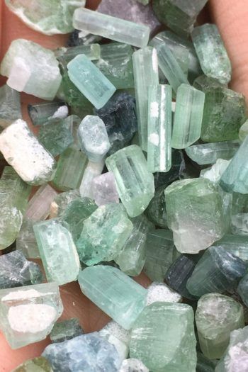 Green Tourmaline Aesthetic, Green Crystals Aesthetic, Green Tourmaline Meaning, Tourmaline Aesthetic, Vibration Raising, Light Green Crystals, Tourmaline Meaning, Energy Vibration, Polished Gemstones