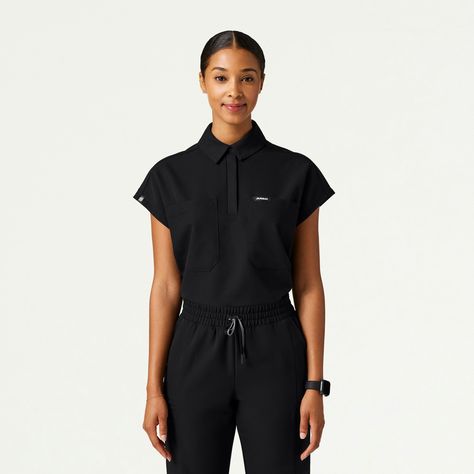 Acta Oversize Scrub Top in Black is a contemporary addition to women's medical outfits. Shop Jaanuu for scrubs, lab coats and other medical apparel. Scrubs Aesthetic, Flexibility And Mobility, Iv Therapy, Uniform Design, Scrub Sets, Medical Scrubs, Chic Top, Tonga, Samoa