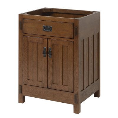 This American Craftsman vanity collection has been inspired by the Arts and Crafts style. The cabinets feature inset doors and drawers, mortise and tenon details, and matching decorative hardware. Crafted from select oak solids and veneers and finished in a beautiful and durable finish will ensure enduring function and beauty for your bath interior. | Sagehill Designs American Craftsman 24" Single Bathroom Vanity Base Only in Rich Amber Wood / Solid Wood in Brown / Gray | 34 H x 24 W x 21 D in | Craftsman Style Bathroom Vanity, Craftsman Style Bathrooms Small, Craftsman Powder Room, Craftsman Vanity, Mission Style Bathroom, Craftsman Style Bathroom, Craftsman Style Bathrooms, Craftsman Bungalow Exterior, Arts And Crafts Bathroom