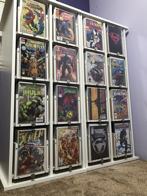 We made 2 separate cabinets for our comic books:) diy project. #nailedit lol Comic Book Library, Comic Book Diy Projects, Diy Comic Book Display, Comic Collection Display, Comic Room Ideas, Comic Book Man Cave, Comic Book Storage Ideas, Comic Themed Room, Comic Book Organization