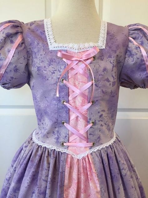 Disney Rapunzel Dress - Rapunzel Inspired Dress Check more at https://beautyfashionideas.com/dress/disney-rapunzel-dress-rapunzel-inspired-dress/ Simple Purple Dress, Rapunzel Inspired Dress, Tangled Dress, Tangled Costume, Princess Aprons, Disney Princess Costumes, Rapunzel Dress, Disney Princess Outfits, Disney Princess Dresses