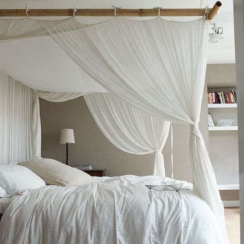 Four-poster bed with white canopy curtains, bedside table, light and shelving. Curtains Around Bed, White Canopy Bed, Neutral Bedroom Design, Canopy Bed Curtains, Neutral Bedrooms, White Canopy, Cool Curtains, Neutral Bedroom, Bed Canopy