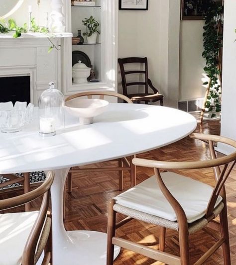 A tulip style dining table with a lacquered white wooden table top with an elegant tapered edge on a matching gloss white aluminium base. Note the stem base is single mould in aluminium without any joints or visible joinings. It tapers to a narrow point in the middle and then tapers out to the base. Also available in Italian marble. Dimensions: Height is 74cm and available in: Circular: 70cm- seats 2 80cm - seats 2 100cm or 110cm (Seats 4) 150cm oval x 100 wide or 170cm x 110cm (seats 6), Delive Oval Tulip Table Dining Room, White Tulip Dining Table, White Dining Table And Chairs, Oval Tulip Dining Table, Eero Saarinen Tulip Table, Oval Kitchen Table, Saarinen Tulip Table, White Round Dining Table, Scandinavian Style Furniture